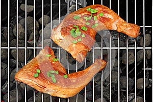 Two BBQ Roast Chicken Quarters On The Hot Charcoal Grill