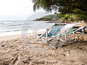 Two beach chairs on the beach 2