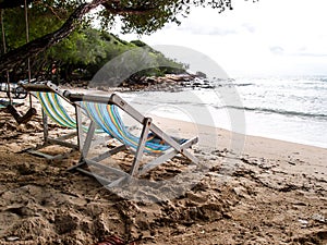 Two beach chairs on the beach 3