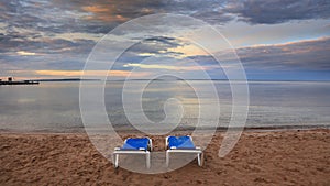 Two beach chairs by Lake Huron