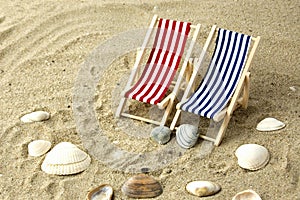 Two beach chairs on the sand