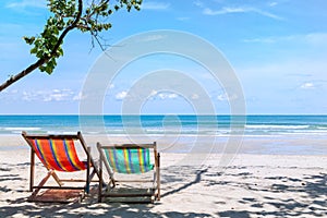 Two beach chairs on the sandy beach near the sea at Koh Chang Th