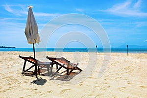 Two beach chairs on a tropical beach
