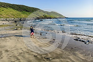 Two beachgoers at Point Lance Beach