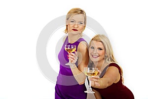 Two beautiful christmas woman drinking champagne