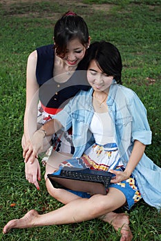 Two beautiful girl on a laptop computer