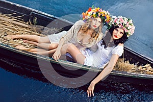 Two beautiful girls in boat