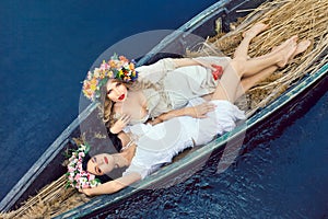 Two beautiful girls in boat