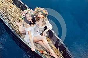 Two beautiful girls in boat