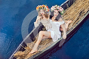 Two beautiful girls in boat