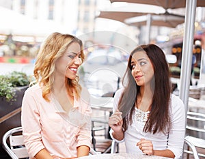 Two beautiful girls in cafe