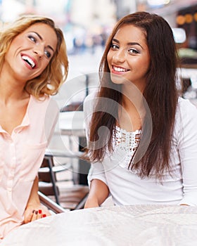 Two beautiful girls in cafe