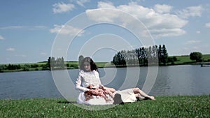 Two beautiful girls with lambs