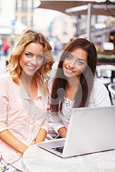 Two beautiful girls with laptop