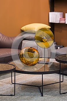 Two beautiful glossy glass golden vases - perfect luxirious interior design elements. Stylish interior art deco