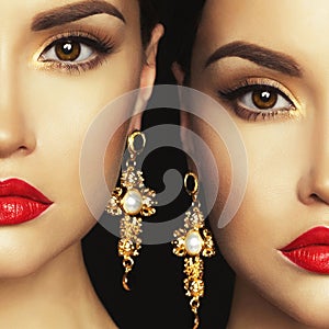Two beautiful lady with earrings on black background