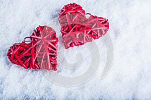 Two beautiful romantic vintage red hearts together on a white snow background. Love and St. Valentines Day concept.