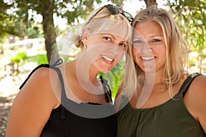 Two Beautiful Smiling Sisters Ourdoor Portrait