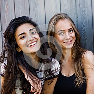 Two beautiful women looking at camera