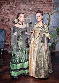 Two beautiful women in medieval dresses