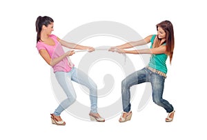 Two beautiful women pulling a rope