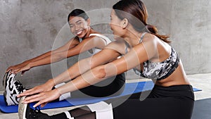 Two beautiful young Asian women at the gym