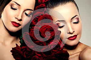 Two beautiful young women with amazing make-up in roses. Cosmetic care, makeup. Sensuality twins. Stylish attractive woman in flo