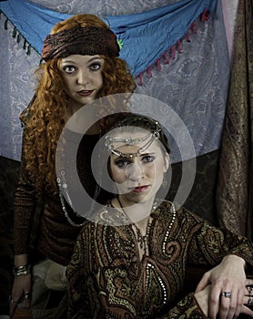 Two beautiful young women dressed as gypsies