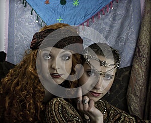 Two beautiful young women dressed as gypsies