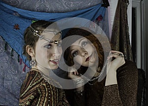 Two beautiful young women dressed as gypsies