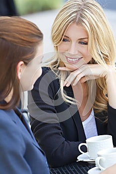 Two Beautiful Young Women Having Coffee