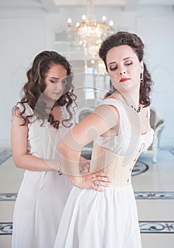 Two beautiful women in old-fashioned negligee photo