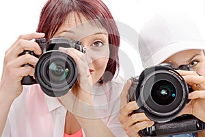 Two beautiful young women using a camera photo