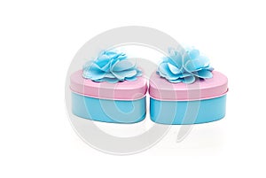 Two beautifully decorated heart shape containers in pastel color