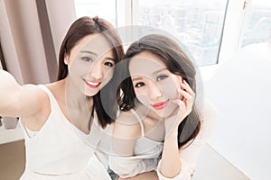 Two beauty woman selfie happily