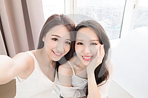 Two beauty woman selfie happily