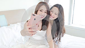 Two beauty woman selfie happily