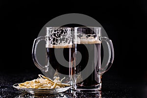 Two beer mugs on table