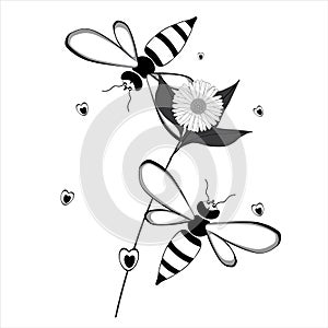 Two bees flying around a flower