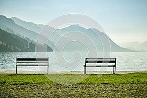 Two benches in small park at the shore of Lake Luzern