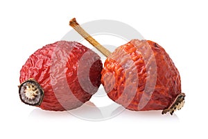 Two berries of dried rose hips isolated on white background. Photo stacking