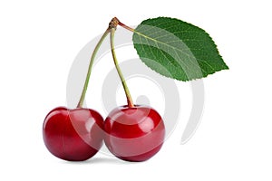 two berries of a ripe juicy red cherry with a green leaf on a white isolated background