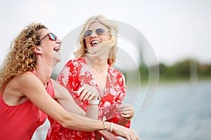 Two best friends laughing in summer day