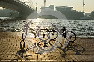 Two Bicicles beside the river