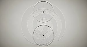 Two bicycle wheels are arranged vertically against a neutral background. Each wheel