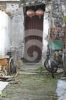 Two bicycles parked outside a slum