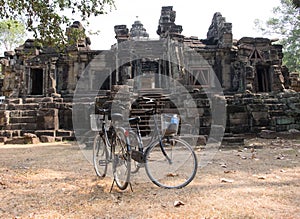 Two bikes on the background of the ruins at Angor Wat