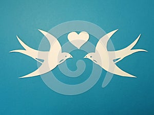 Two birds and heart. Paper cutting.