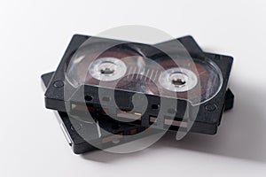 Two black audio cassette on white background