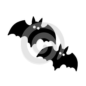 Two black bats with white eyes on a white background
